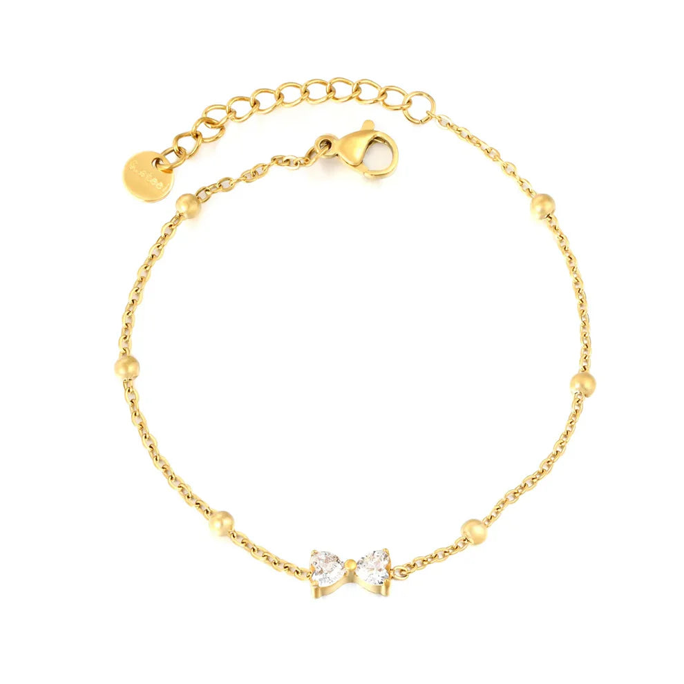Pulsera Moño Circón para mujer tipo hilo fino en dorado. Joya waterproof delicada y femenina, perfecta para usar sola o combinar con otras joyas waterproof y elegante.