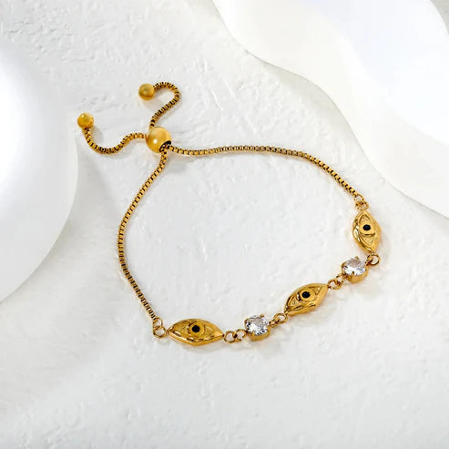 Pulsera para mujer cadena con detalles de ojito y brillo que aportan un toque especial y femenino. Joya waterproof llamativa y versátil, resistente al agua, perfecta para looks creativos y juveniles.