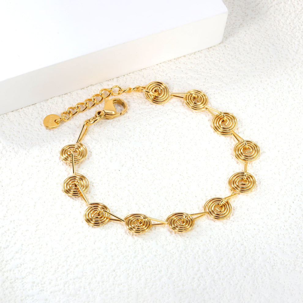 Pulsera Espirales Waterproof: elegancia y arte en acero inoxidable y oro 18K. Resistente al agua, diseño único en eslabones espiral. ¡Descúbrela!