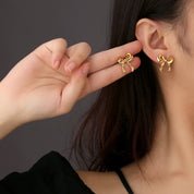 Aretes Coquette Waterproof - Joya en acero inoxidable enchapado en oro 18k - D'Merys