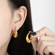 Argollas Olinda Waterproof - Joya en acero inoxidable enchapado en oro 18k - D'Merys