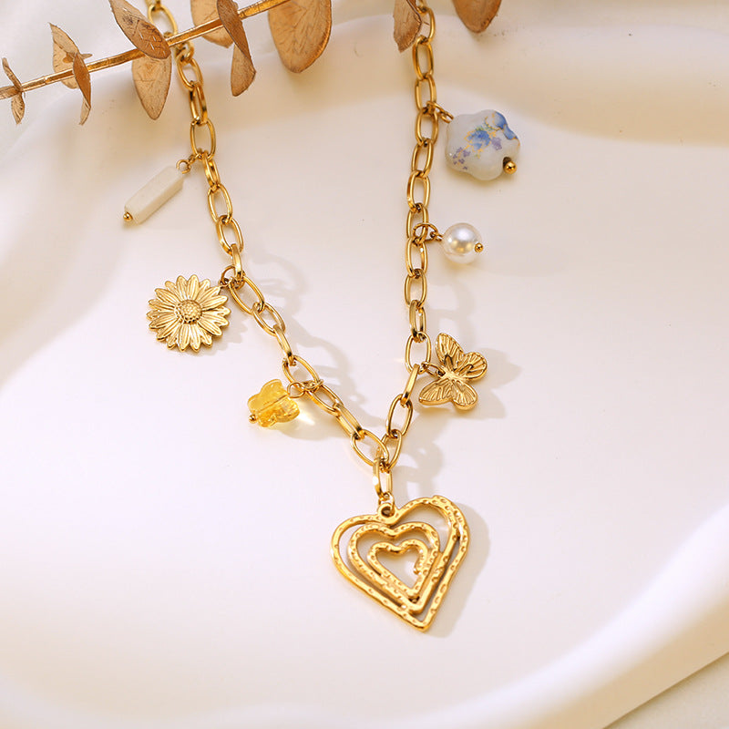 Collar waterproof con charms florales dorados. Acero 316L enchapado en oro 18k: no se oxida ni mancha. Envío a todo el Perú